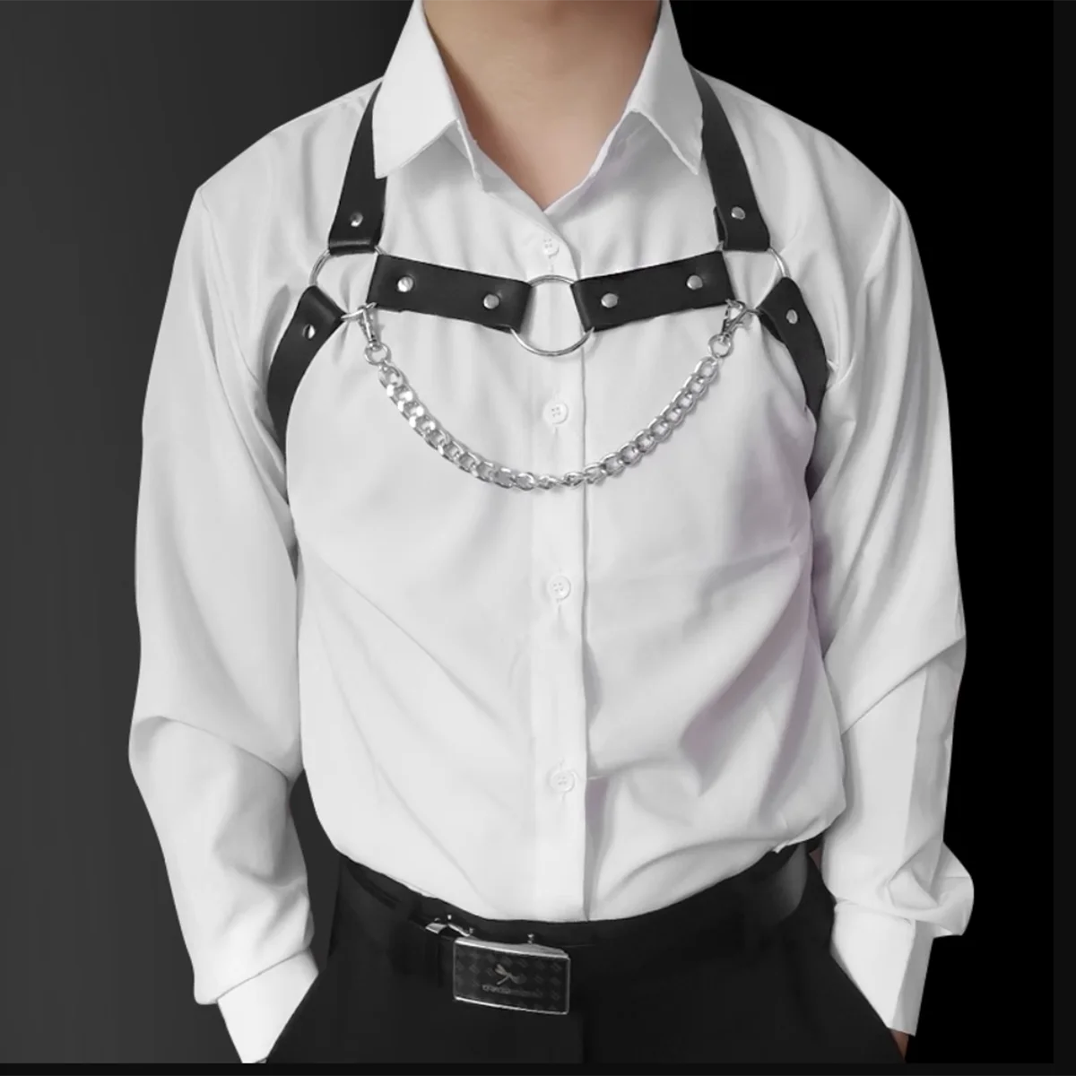Black chain-detail chest harness layered over a white button-up shirt