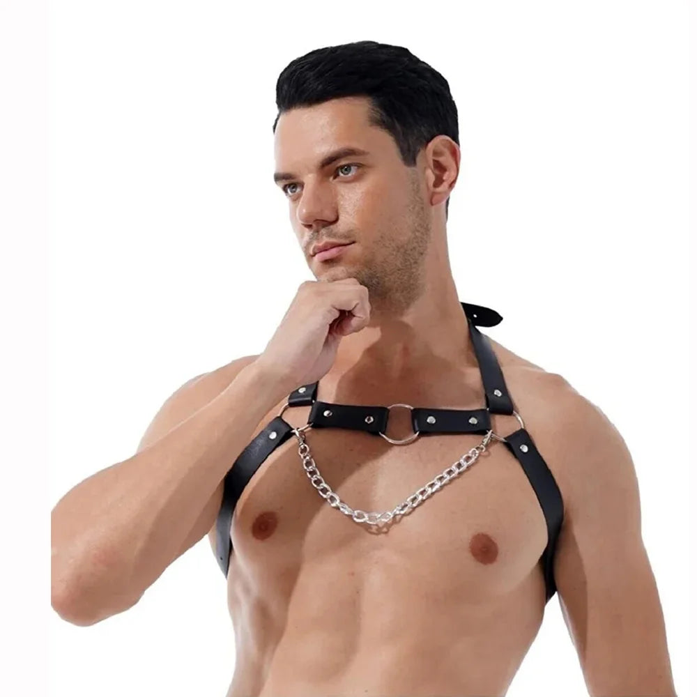 Front of a black chest harness with a draped silver-tone chain