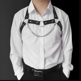 Black chain-detail chest harness layered over a white button-up shirt